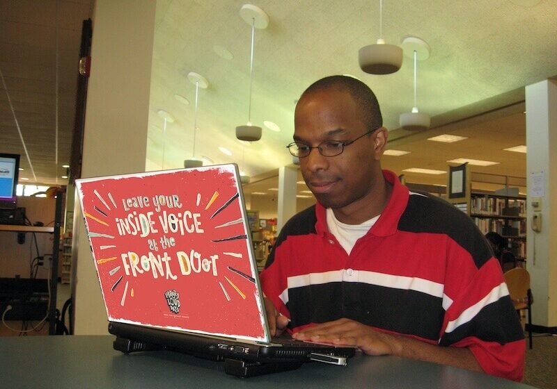 Milwaukee-Public-Library-Foundation-Man-Working-on-Library-Laptop