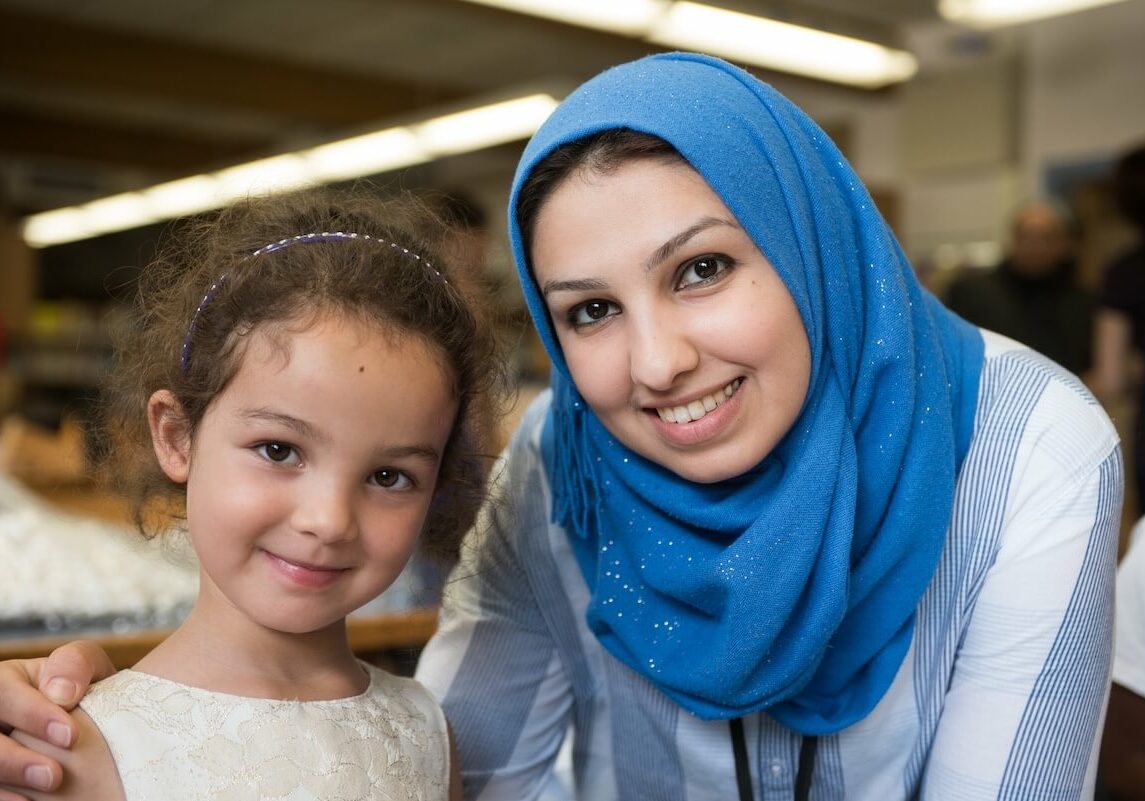 Milwaukee-Public-Library-Foundation-Smiling-Patron-With-Child Milwaukee-Public-Library-Foundation-Smiling-Patron-With-Child